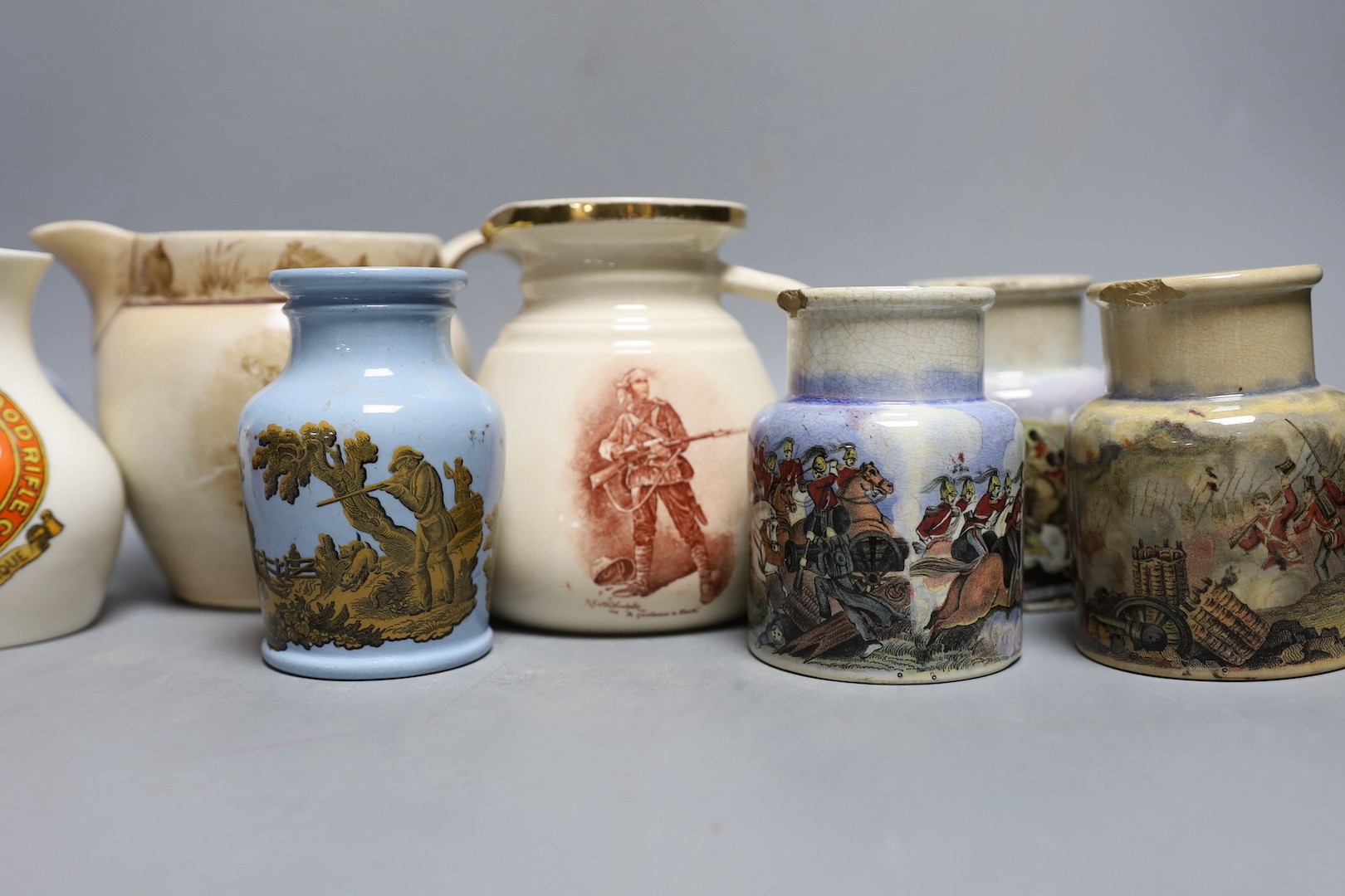 Crimean, Boer war, WWI and shooting commemorative ceramics - including Pratt ware pots, a gentleman in khaki jug and saucer, a rifle contest Wimbledon 1865 pot lid, a Goss Hendon and Cricklewood rifle club vase etc.